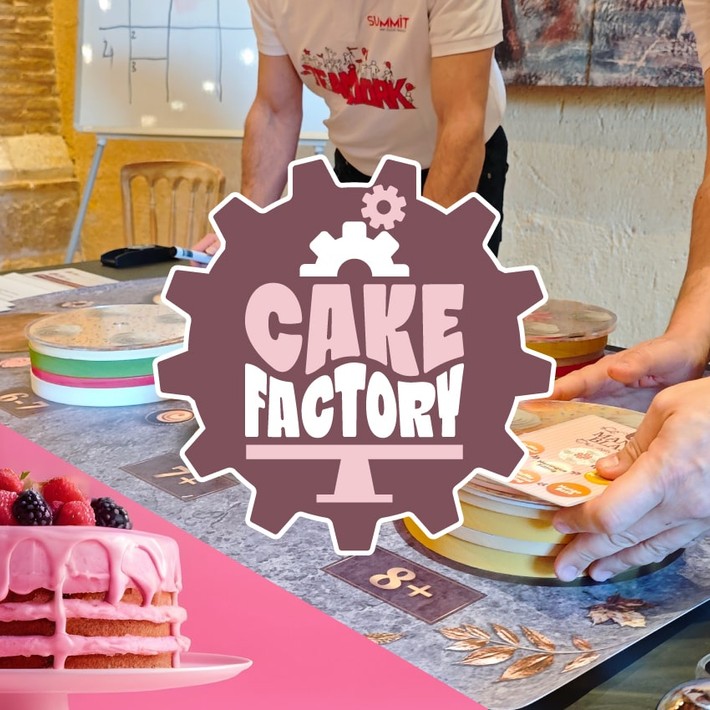 The Cake factory Team Building Activity with people building fake cakes on a table
