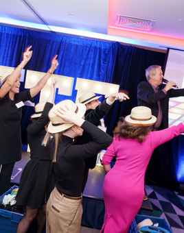 Christmas team building event with colleagues playing Disco Bingo and having fun