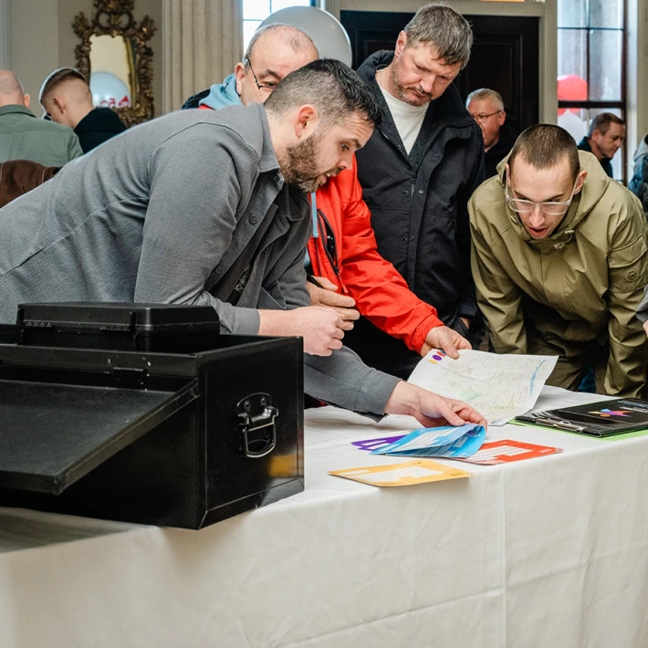 Corporate team building activity in Ireland with colleagues solving the Code Breaker indoor challenge