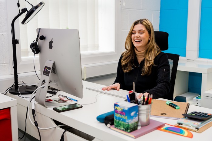 lauren laughing at desk