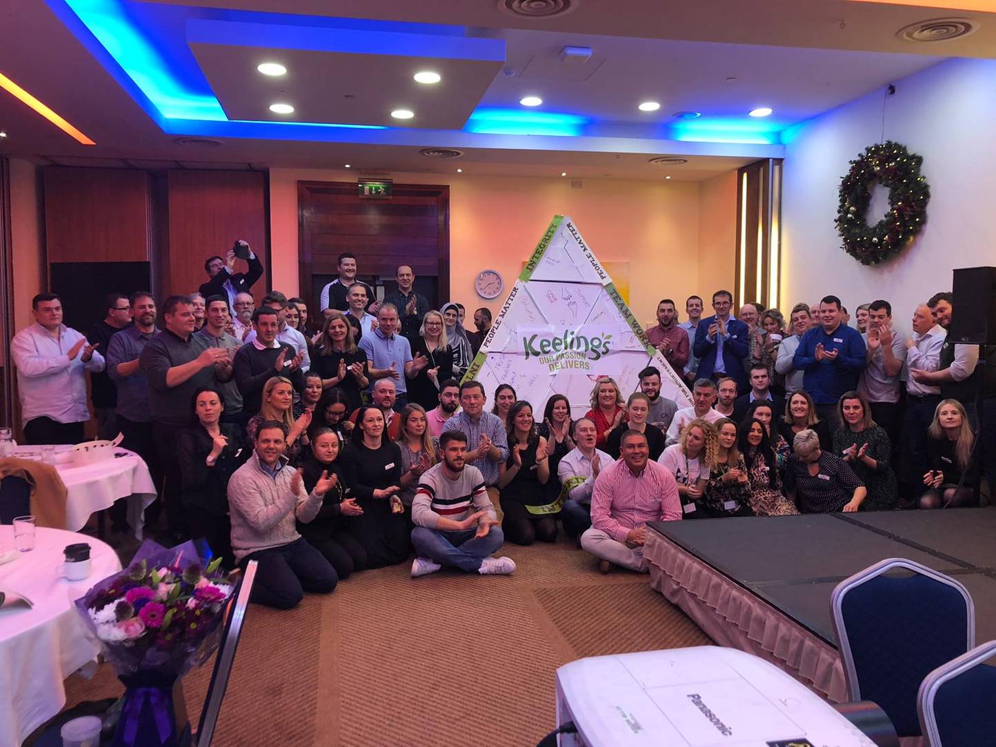 group of people with cardboard pyramid