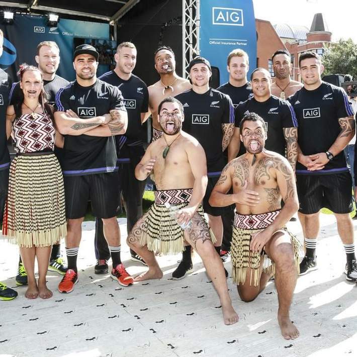 all blacks posing with maori warriors