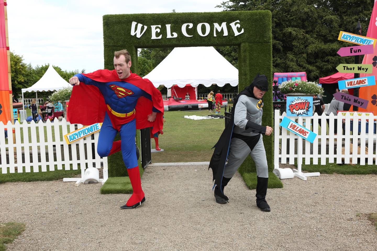 men dressed as superman and batman