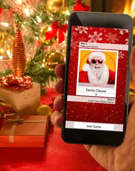 christmas crackers game on phone with christmas presents and tree in the background