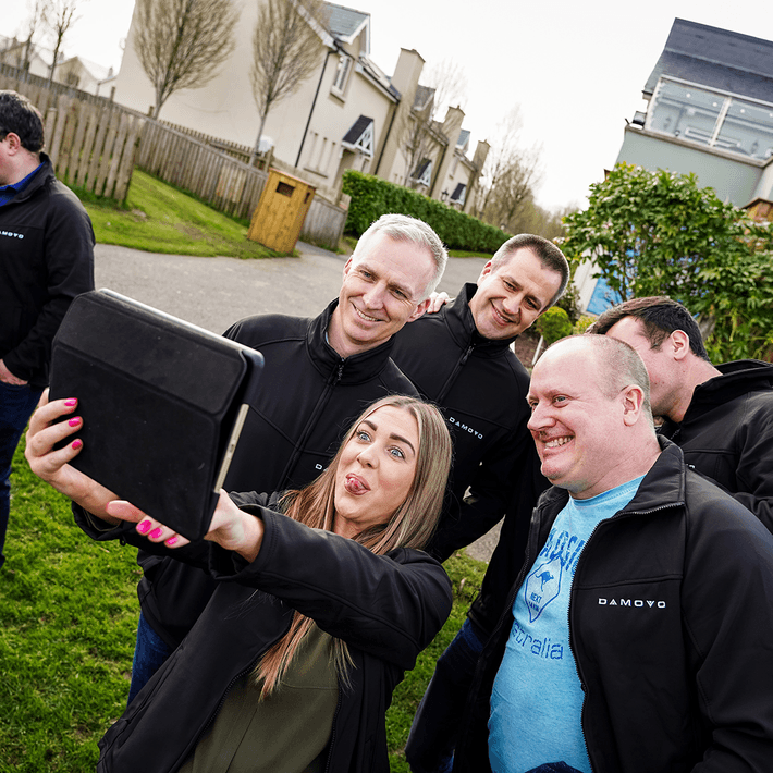 team posing for selfie