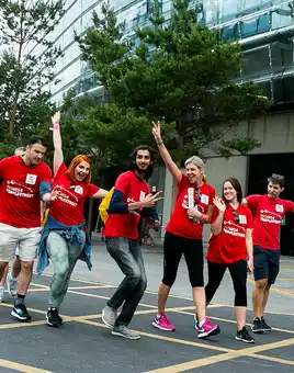 University staff team taking part in an outdoor urban team building activity in Dublin, organised by Dynamic Events Ireland.