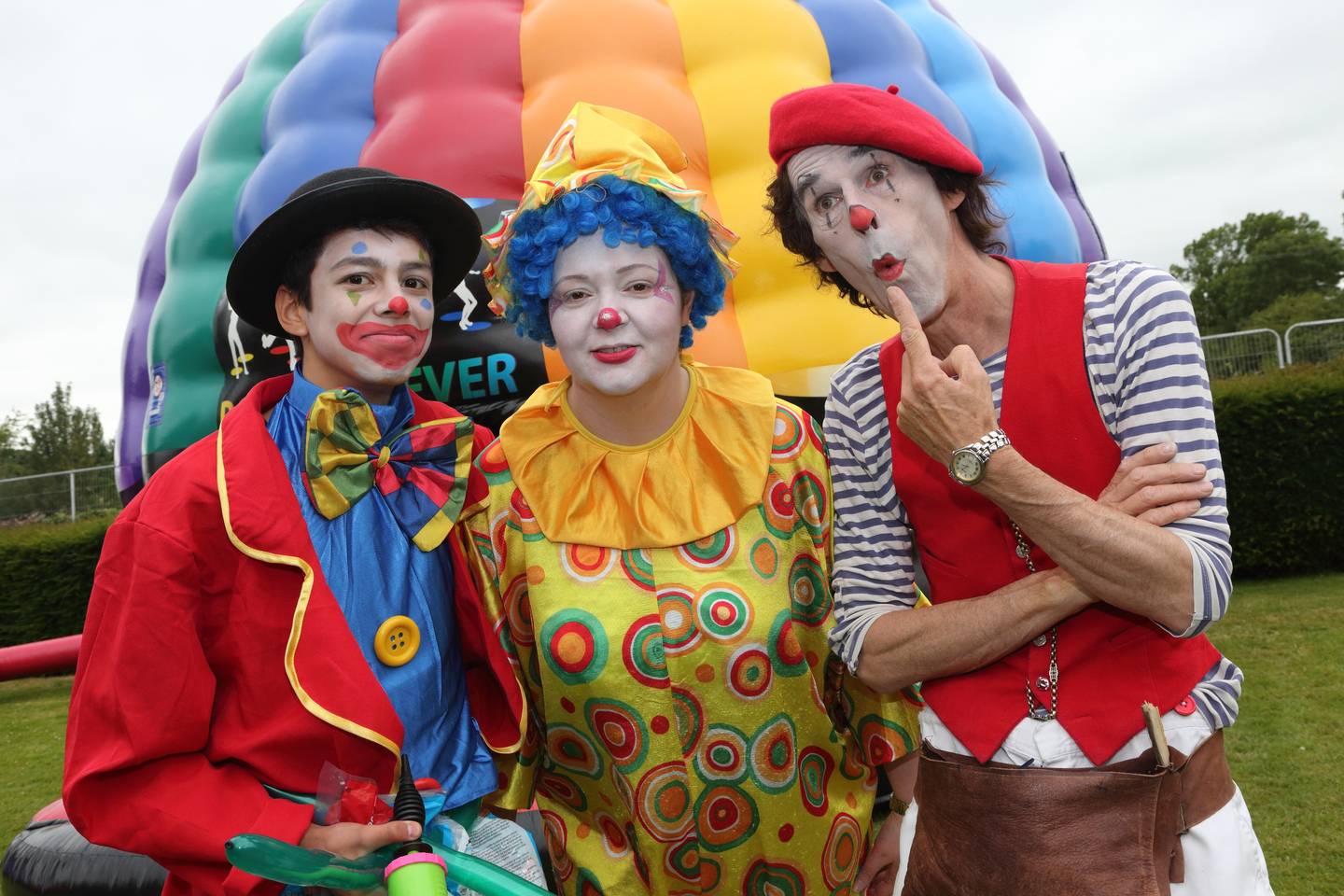 Clowns in front of hot air balloon