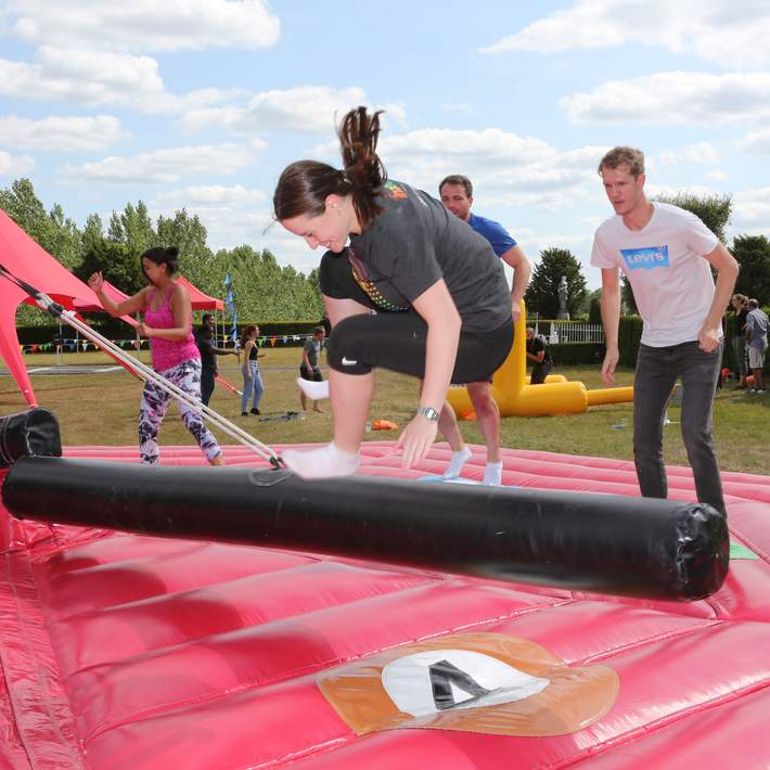 person jumping on inflatable