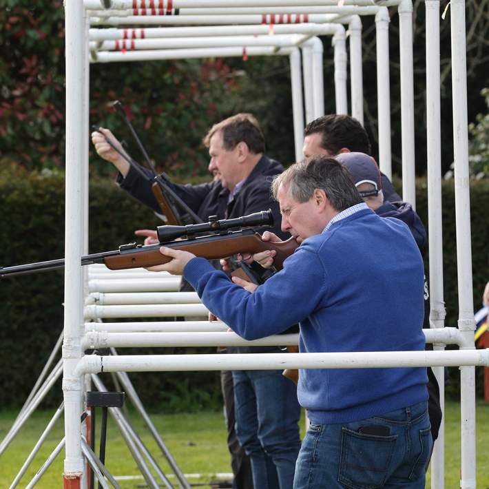 men using air rifles