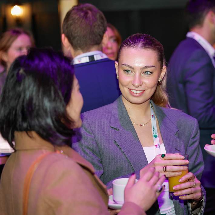 women netwroking at a conference 