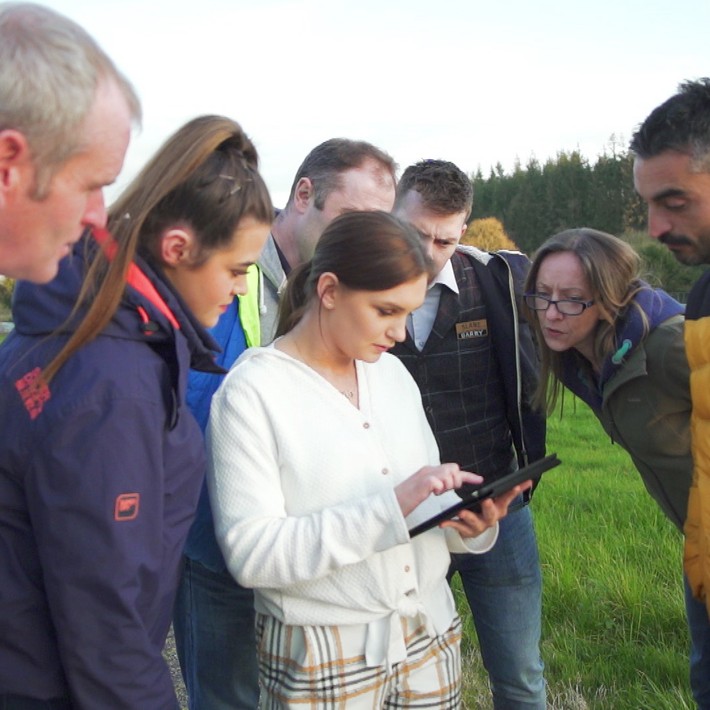 people looking at ipad