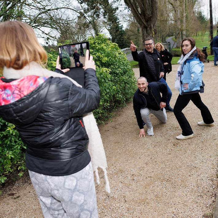 team shooting a photo challenge on digital treasure hunt team building event