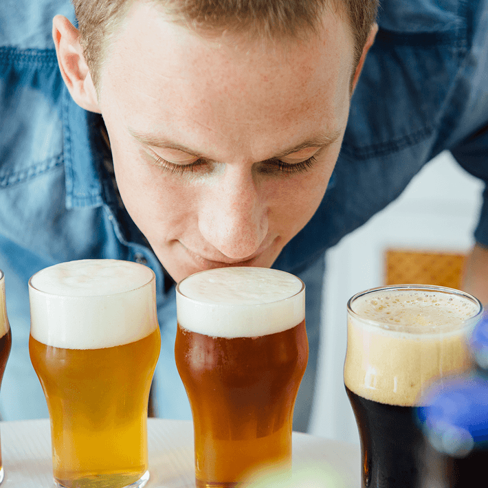 man tasting beer