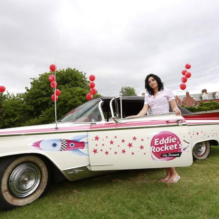 eddie rockets waitress with vintage car