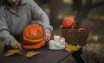 Carving a pumpkin with candles lighting