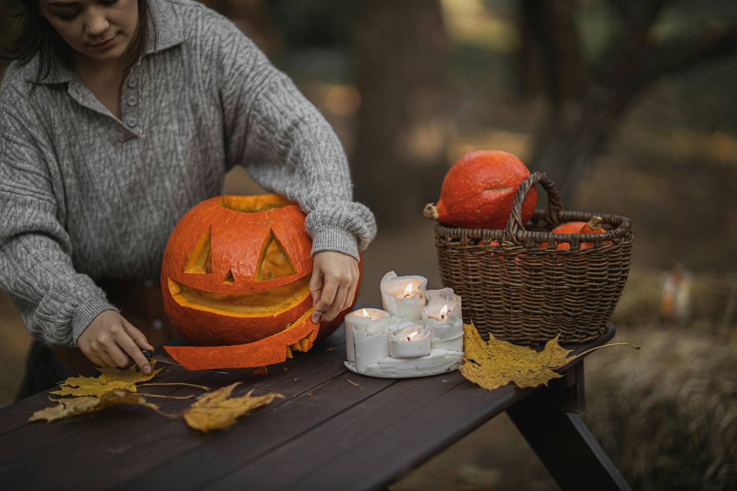 Carving a pumpkin with candles lighting