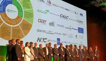 group of delegates standing on stage