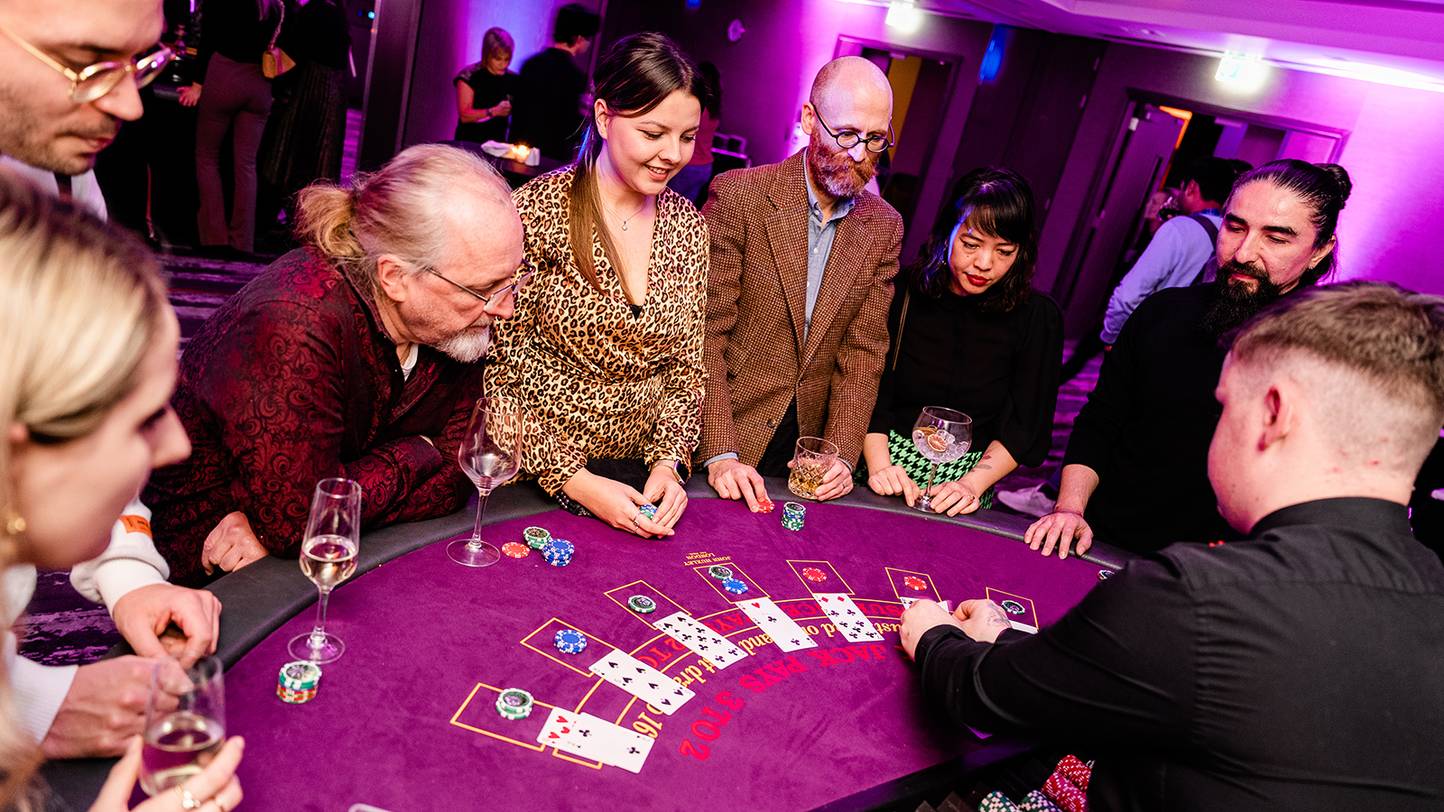 people playing at casino table