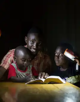 A family living in energy poverty with solarbuddy lights built by corporates in ireland