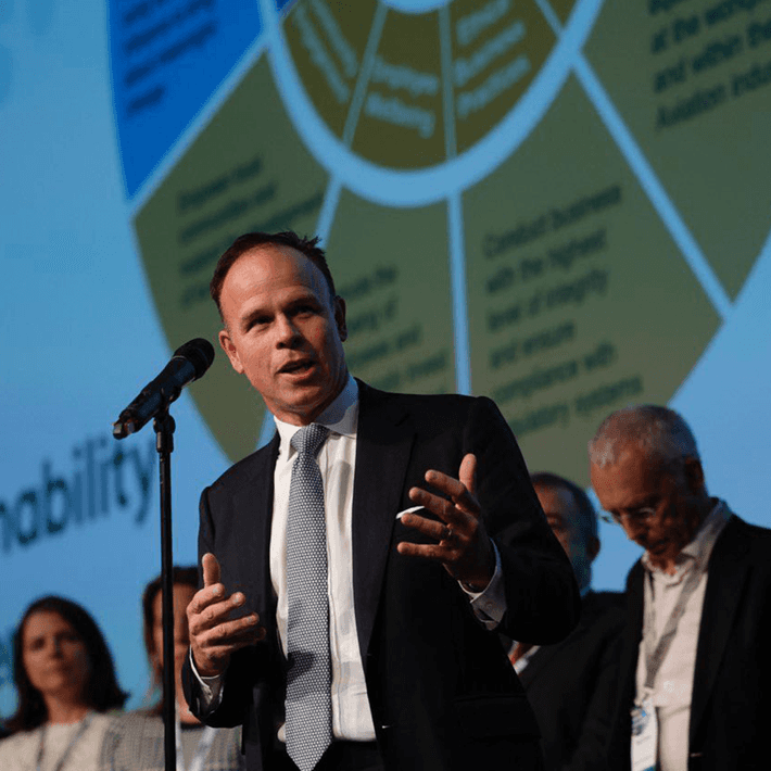 man speaking at conference