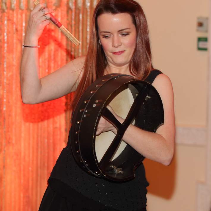 woman playing bodhran