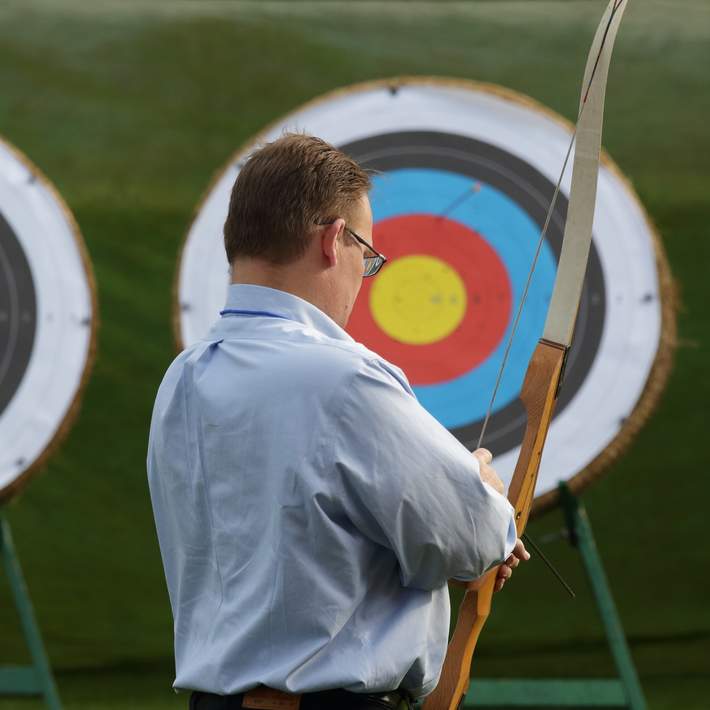 man loading arrow into bow